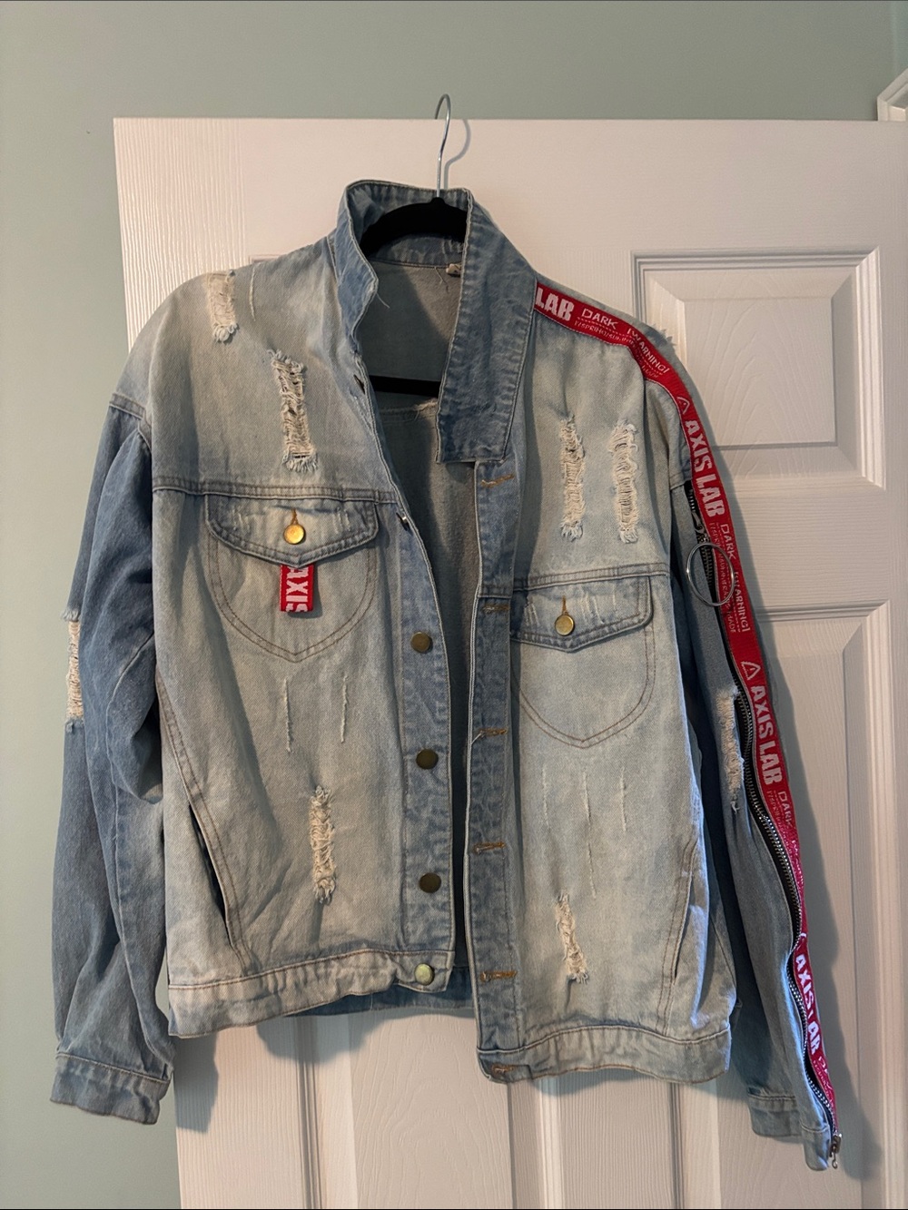 Light Wash Distressed Denim Jacket with Red Stripe Detail